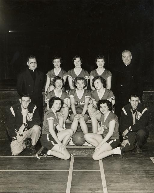 Late 1950s. Jenny, St Pat's basketball. Father Claude, Father Engleman and Mary Downey.