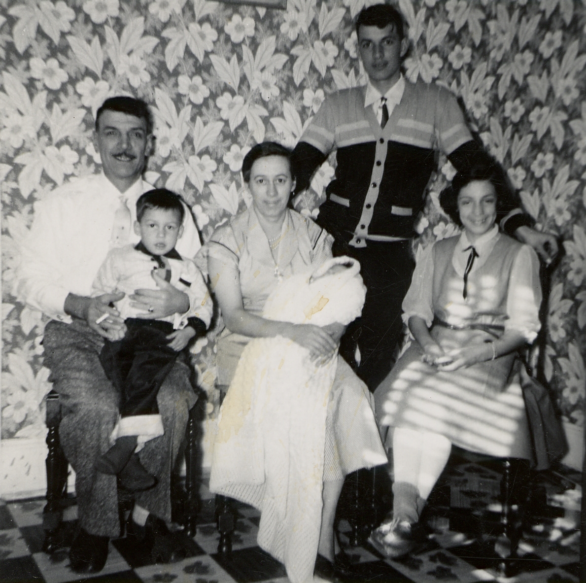 1960s. Zio Bertolo holding Johnny?, Zia Lisa holding Peter?, Albert and Mary.